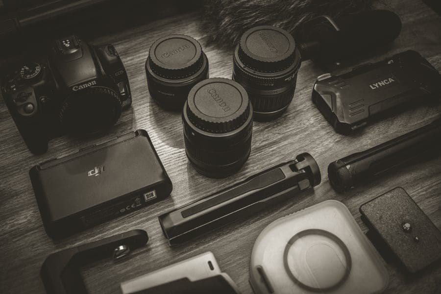 An instant camera with film packs, an album and a case laid out